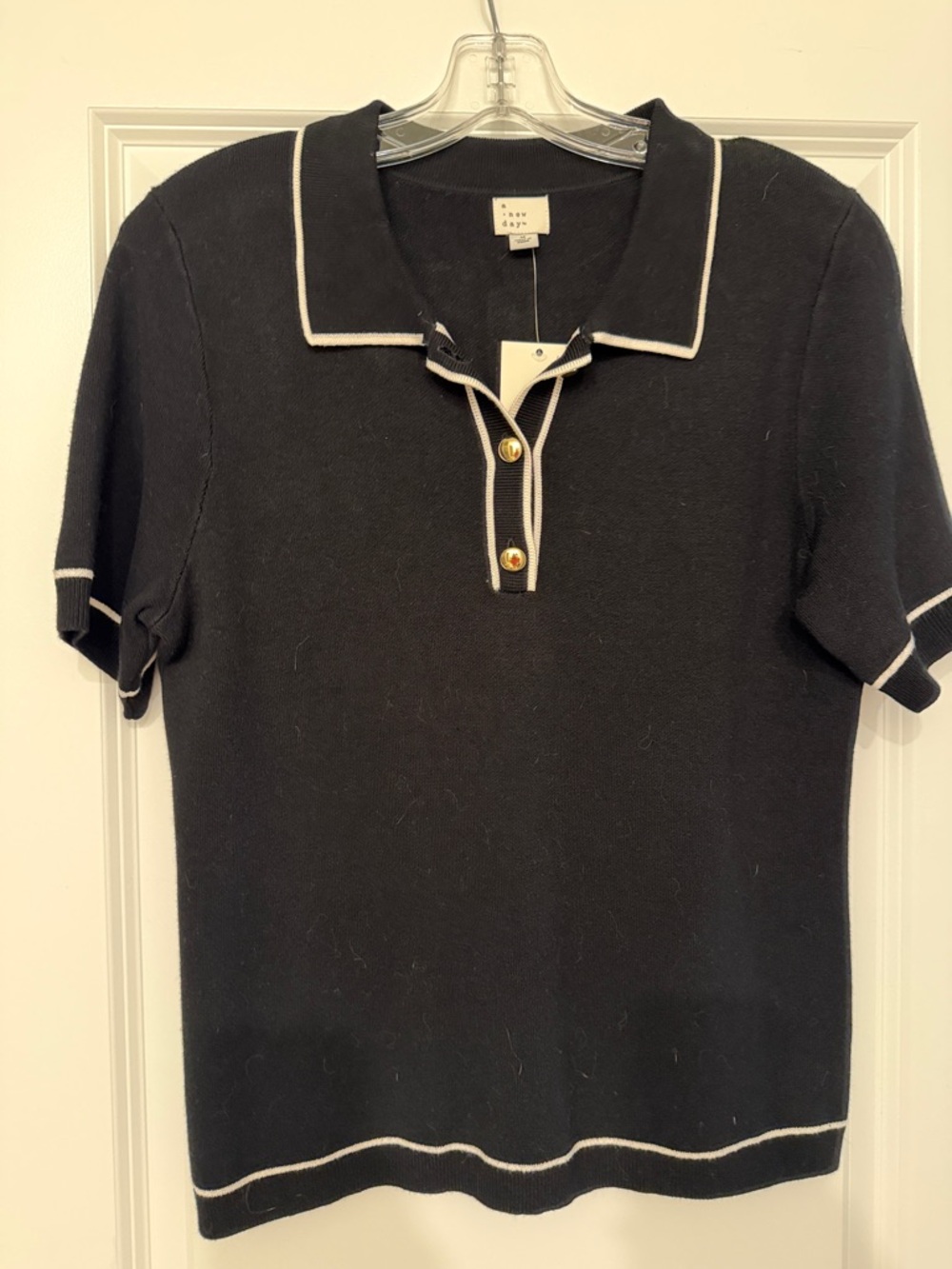 a new day Black Polo Sweater with White Trim